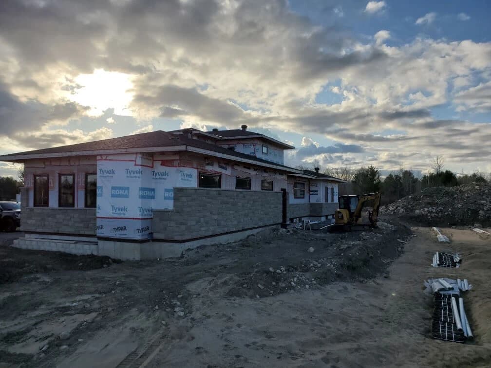Exterior home construction showing foundation and stonework by PSD Renovations in Ottawa